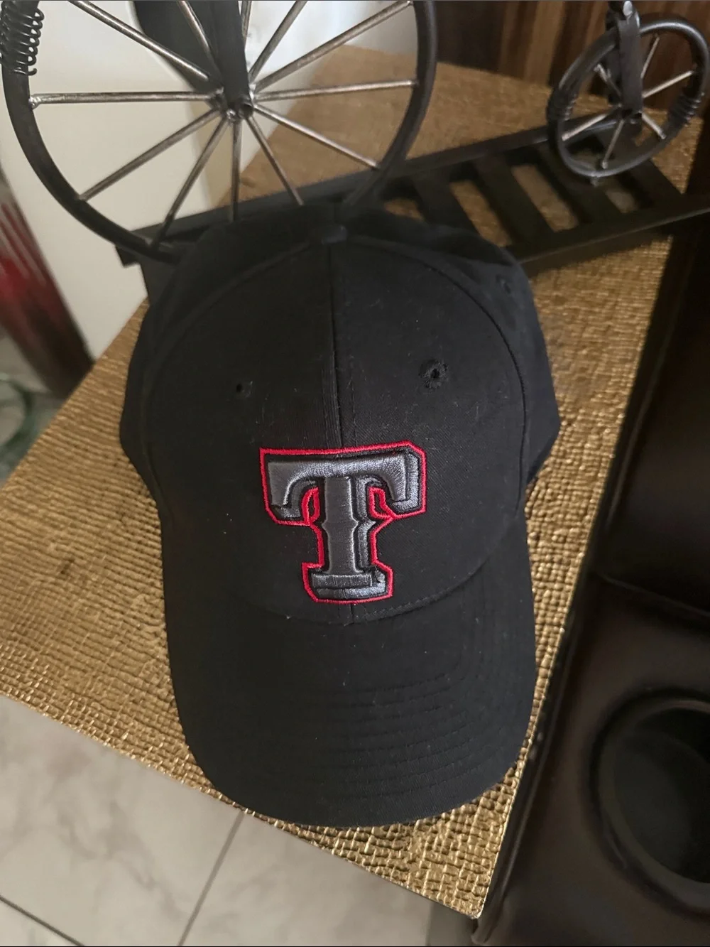 Black Baseball Cap with Embroidered 'T' Logo